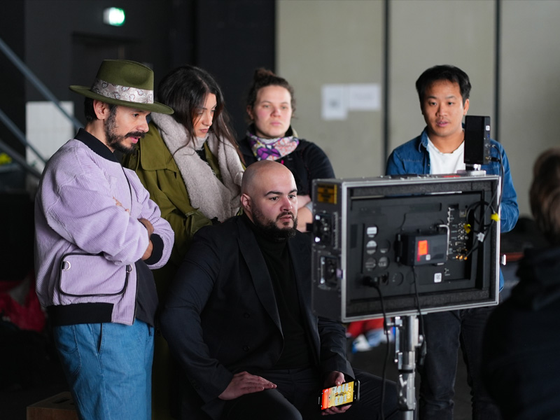 Directing cast and crew on set